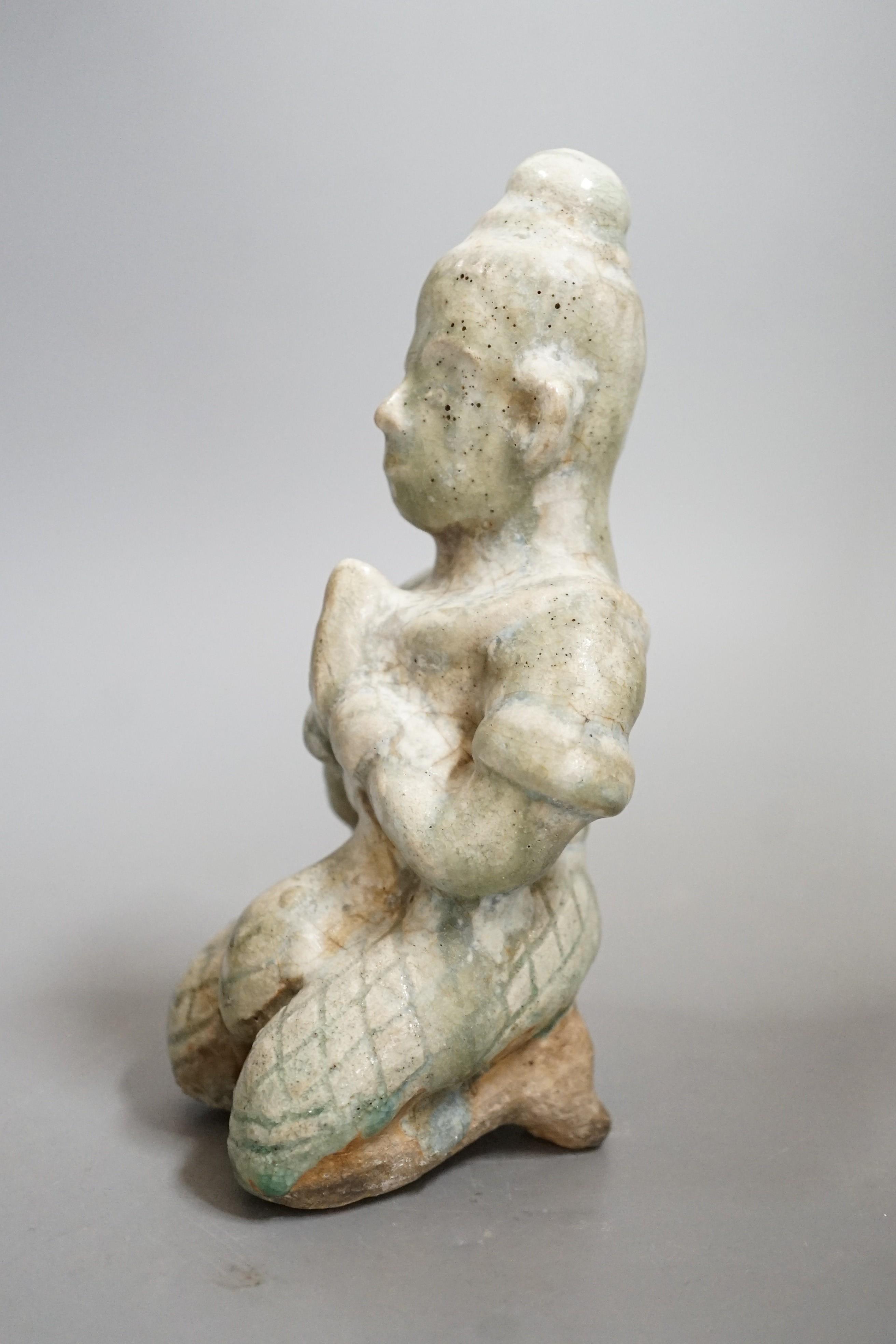 A Thai celadon Buddhist figure, Si Satchanalai, c.1450-1599, 18cms high